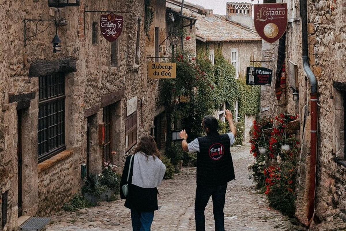 two people walking down a street in an alley