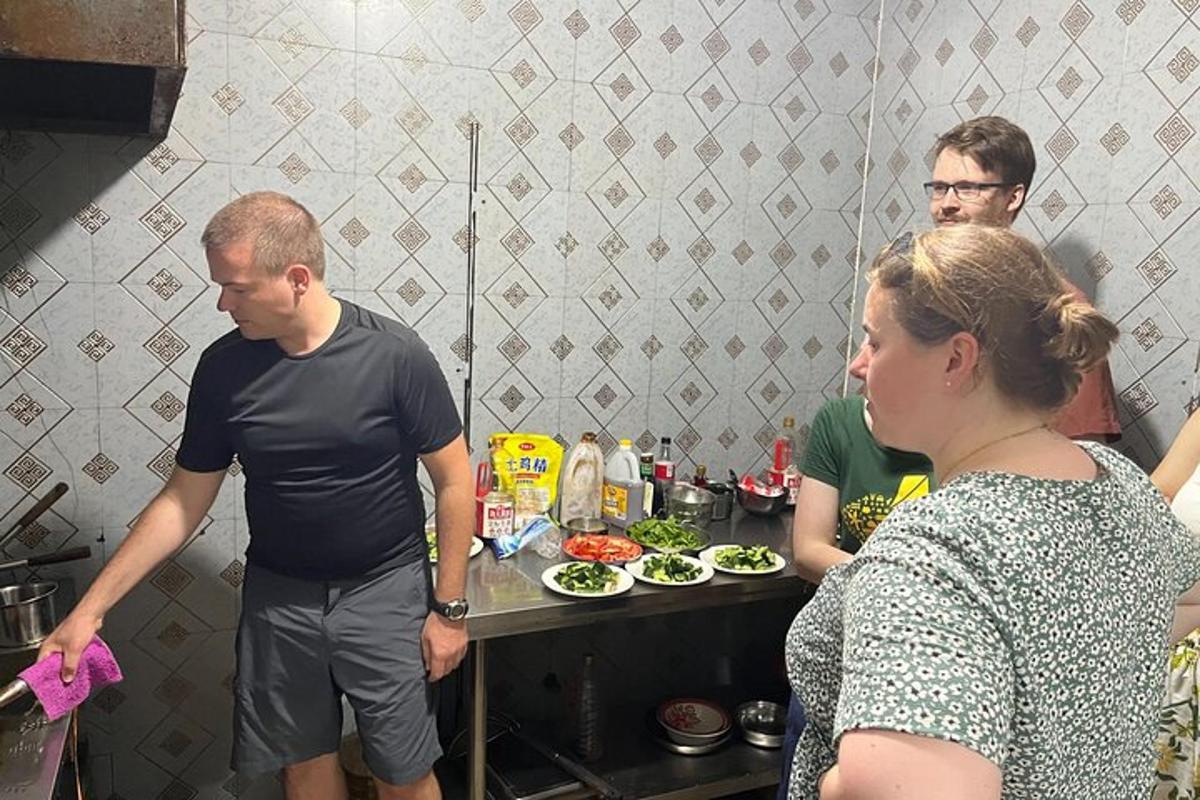 a group of people in a kitchen preparing food