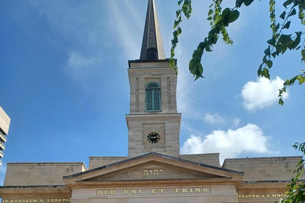 a church with a steeple with a clock on it