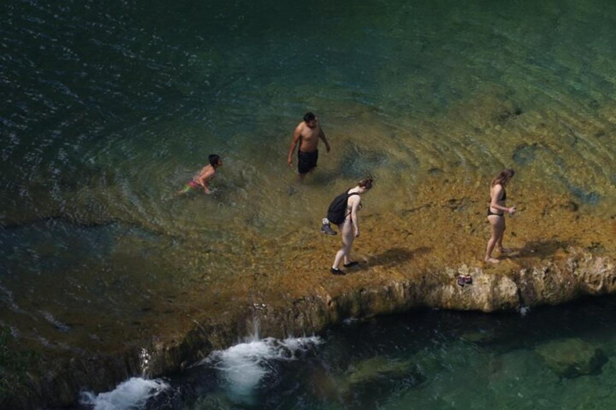 a group of people swimming in the water