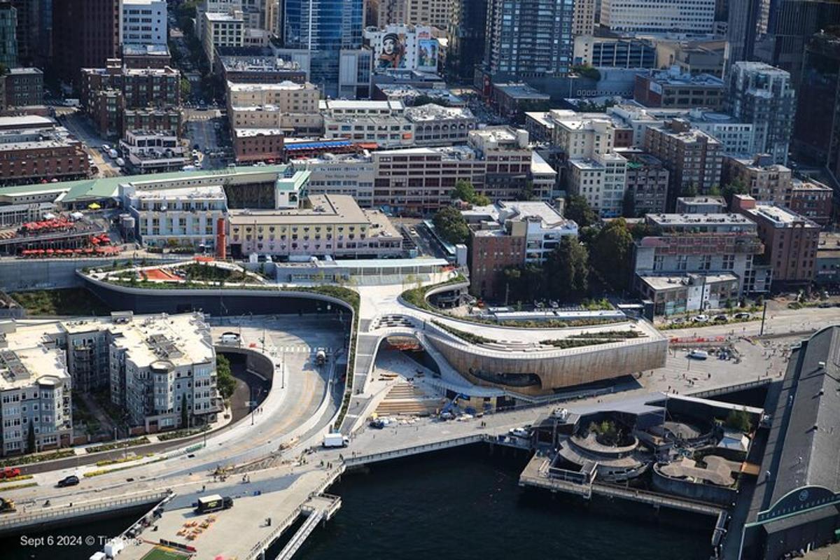an overhead view of a city with a bridge