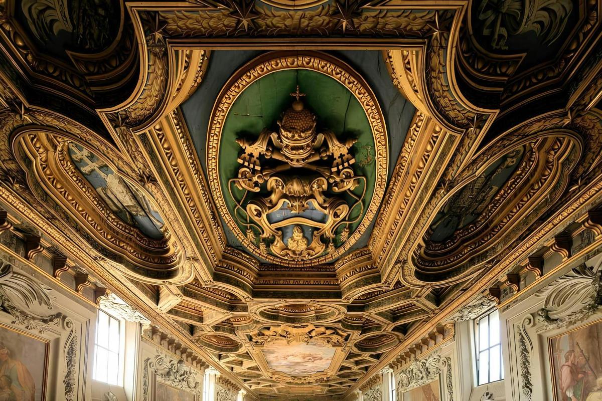 a room with a ceiling with a painting on it