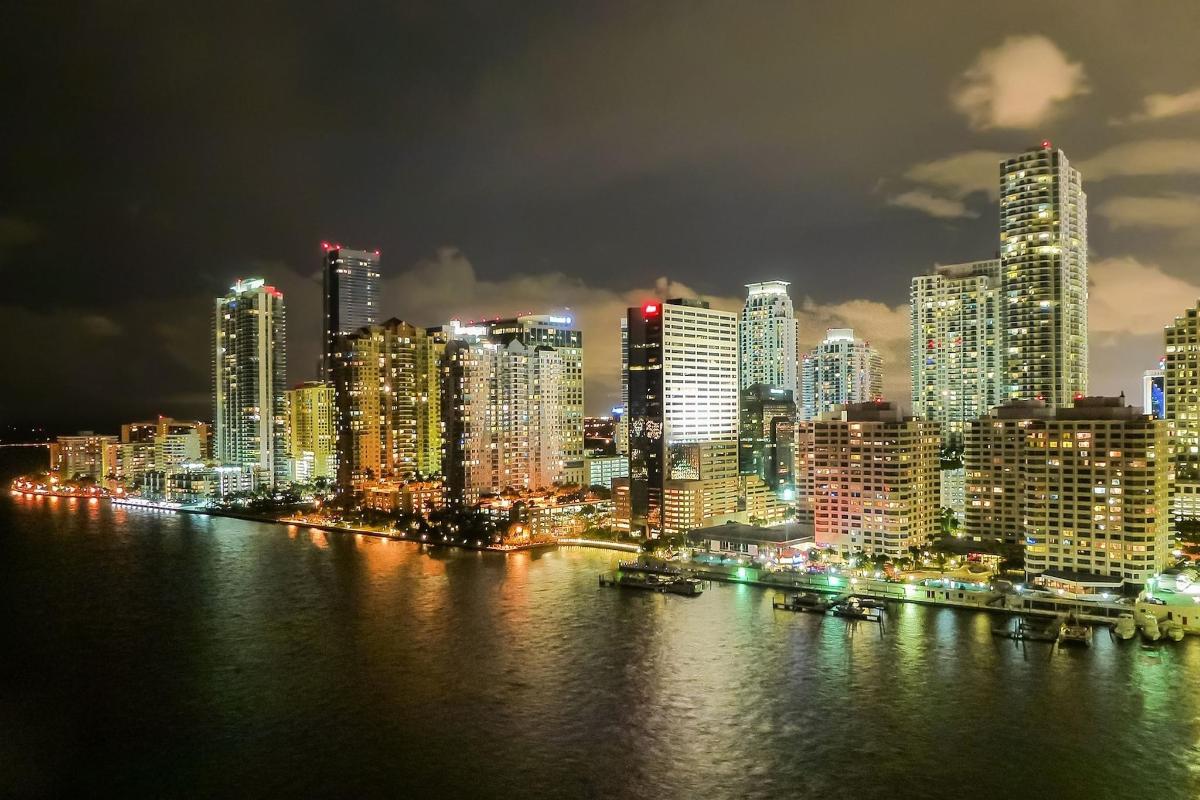 a city lit up at night with a city
