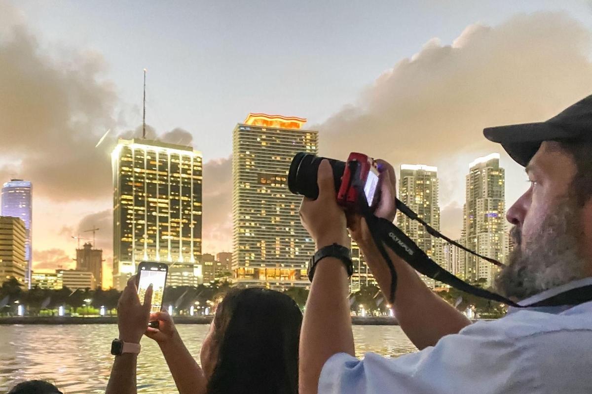 a man taking a picture of a city skyline
