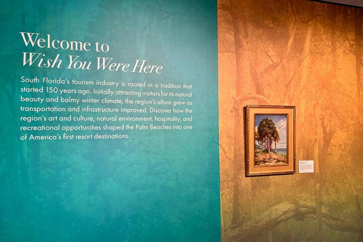 a sign that says welcome to wish you were here on a wall