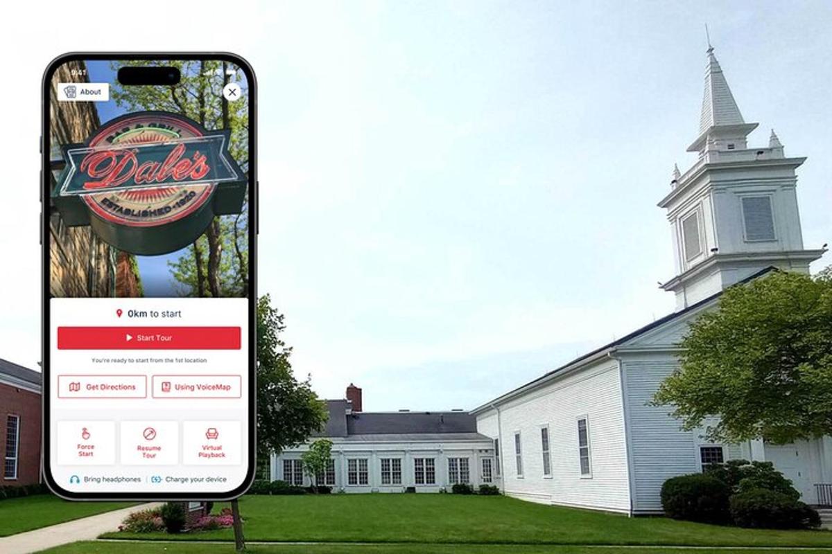 a cell phone next to a building with a church