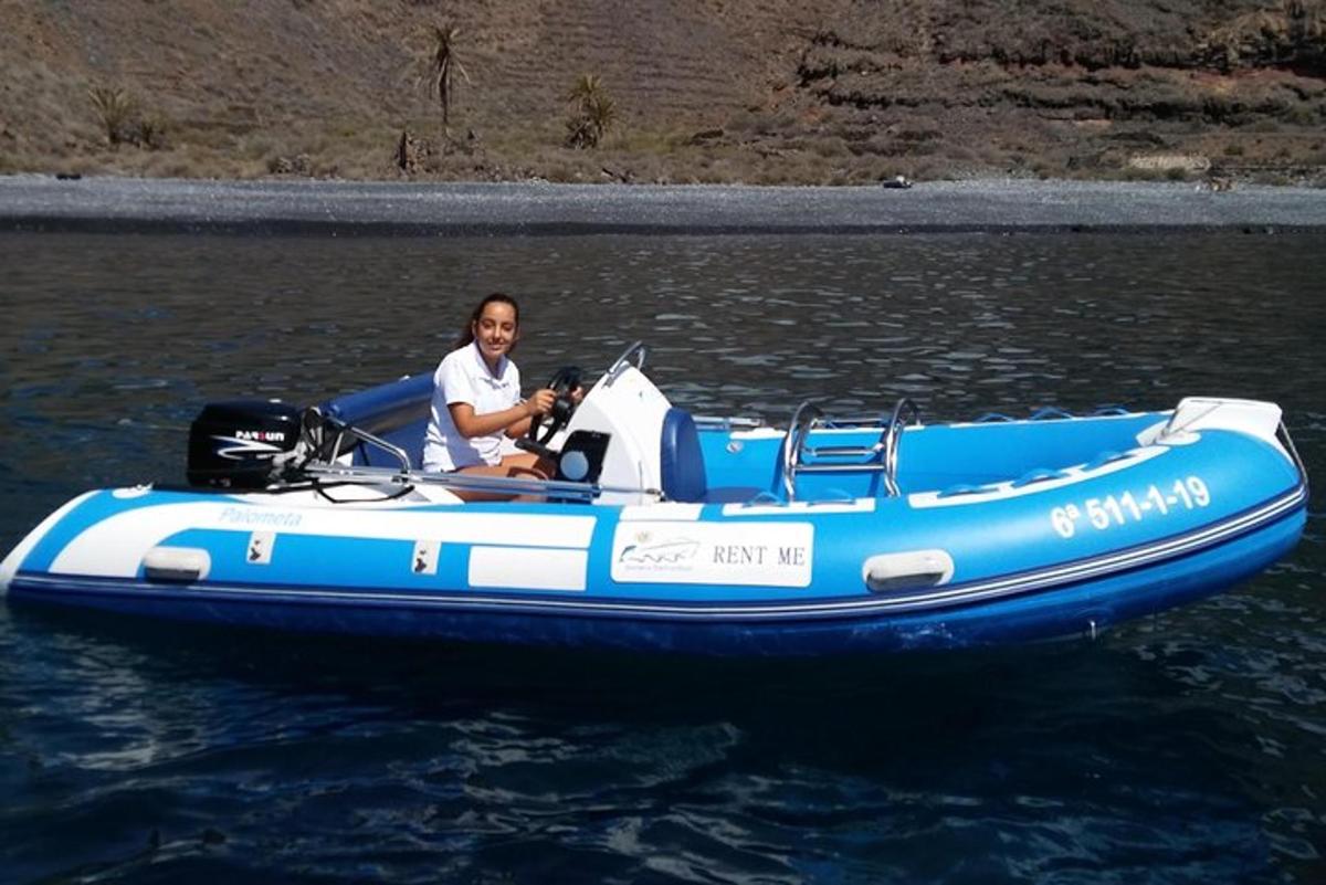 a man in a blue boat on the water