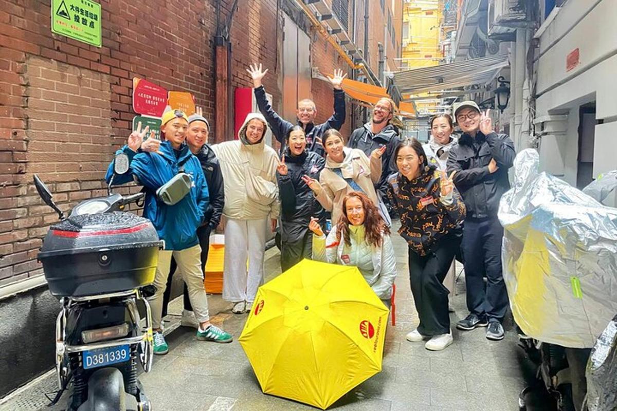 a group of people posing for a picture on a street