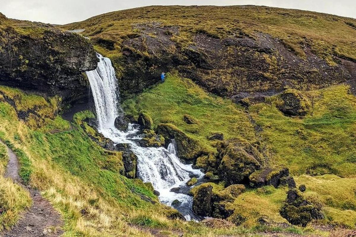a waterfall on the side of a mountain