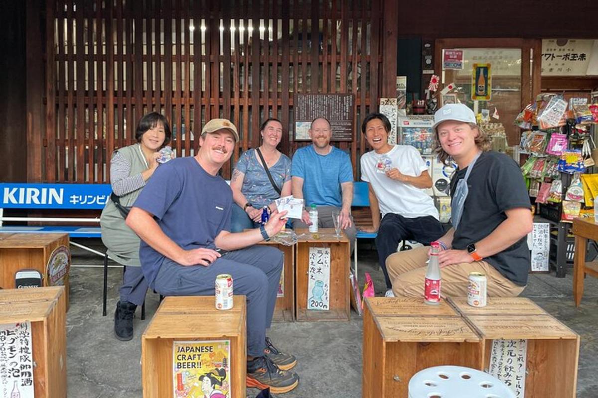 a group of people sitting on tables in a store