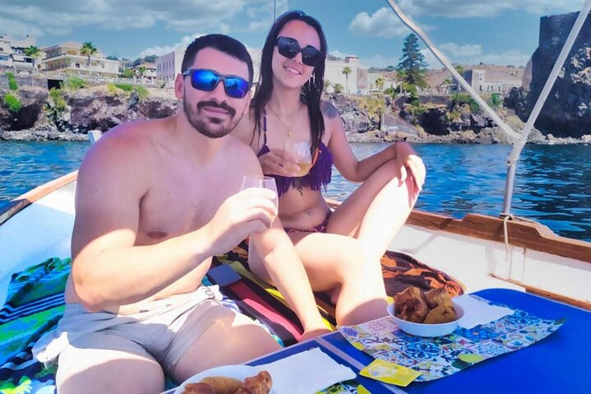 a man and a woman sitting on a boat