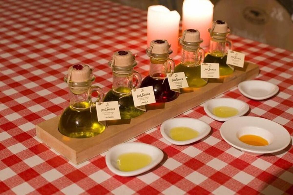 a table with three bottles of oils on a table
