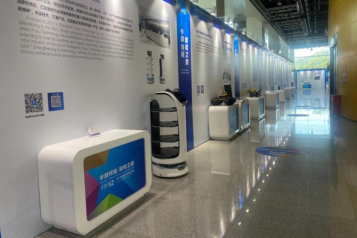 a hallway with a row of check in machines
