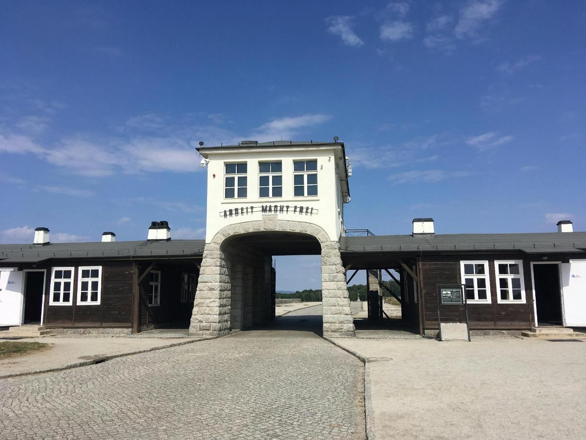 a building with an arch in front of it