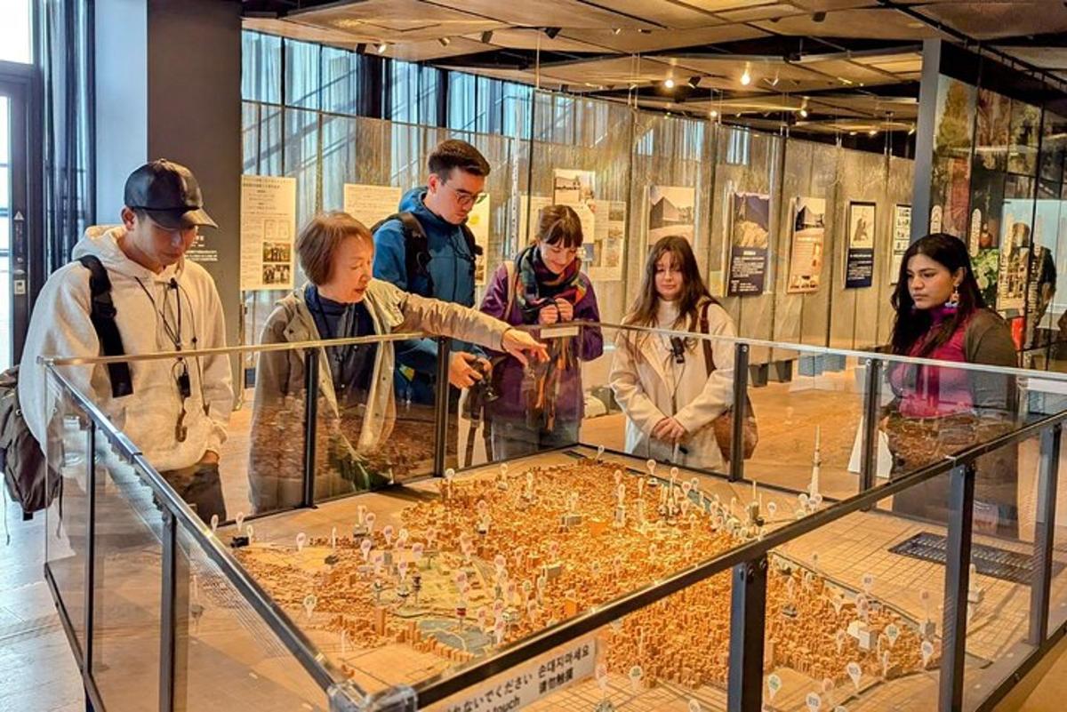 a group of people looking at a museum exhibit