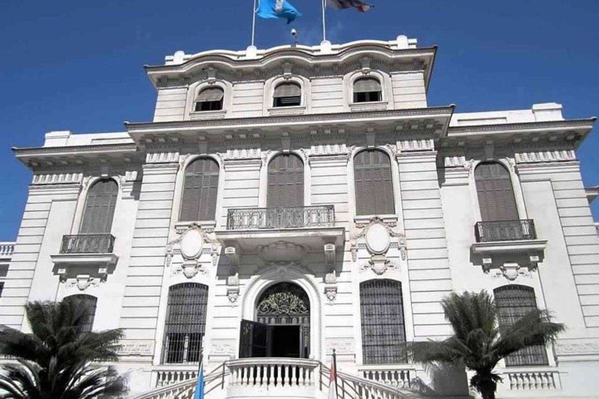a white building with a flag on top of it