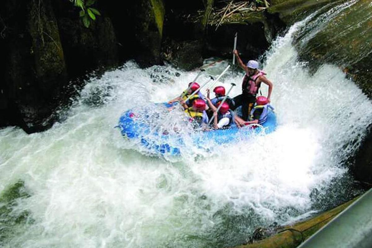 a group of people on a raft in a river