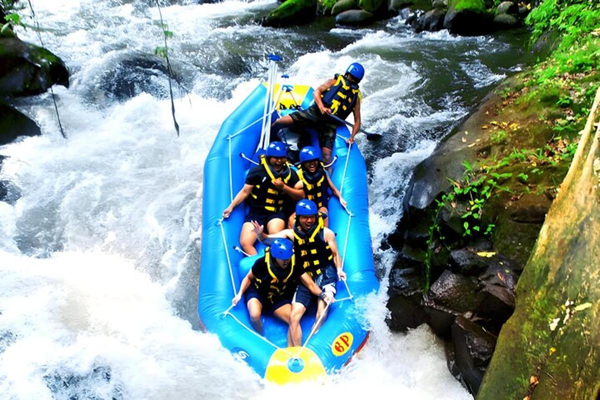 a group of people in a raft in a river