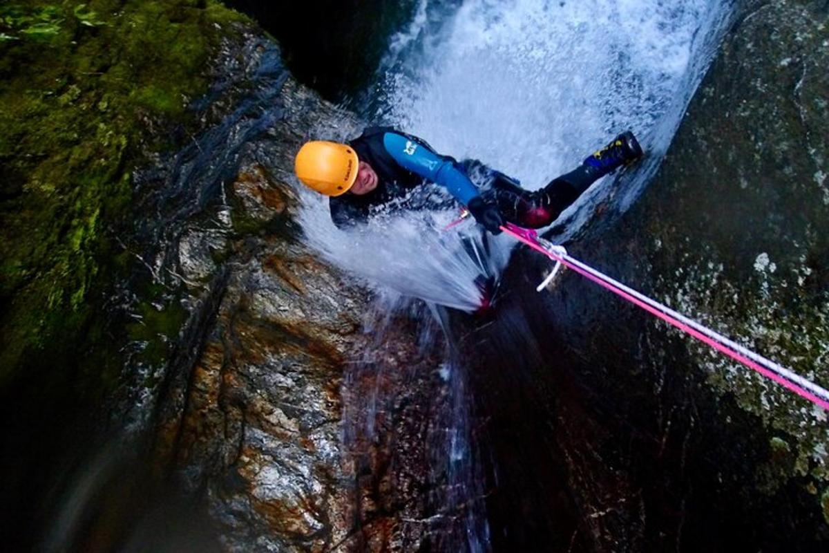 a man in a raft on a waterfall