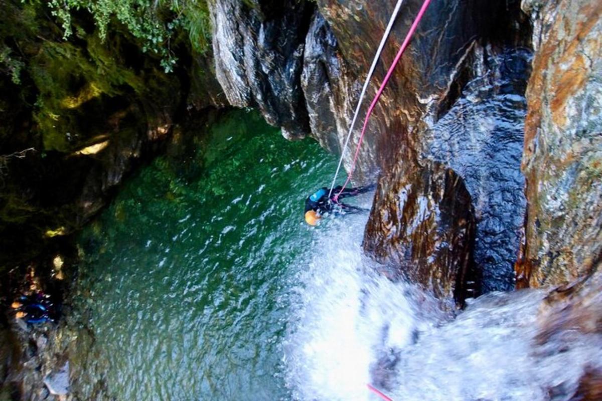 a person in a raft in a river in a cave