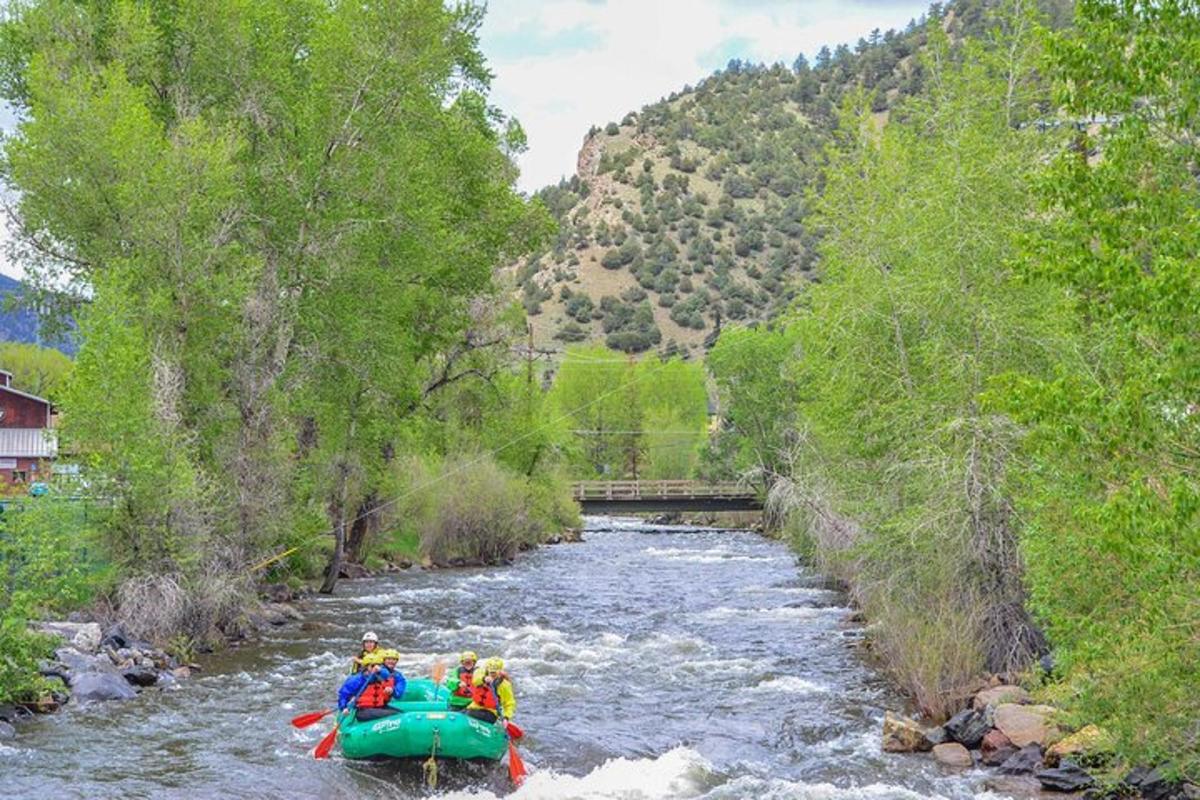 a group of people on a raft in a river