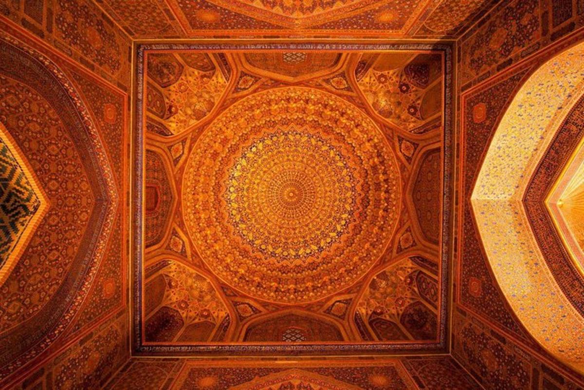 a ceiling of a building with a painting on it