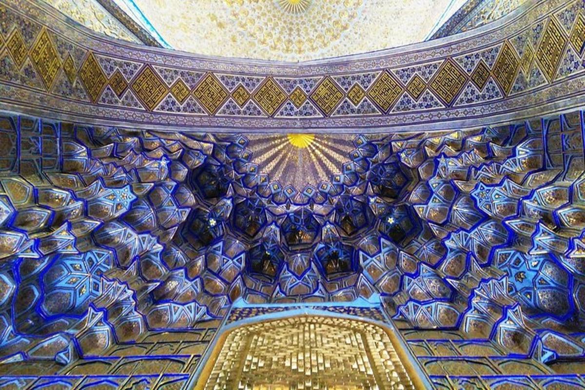 a ceiling of a building with blue and gold