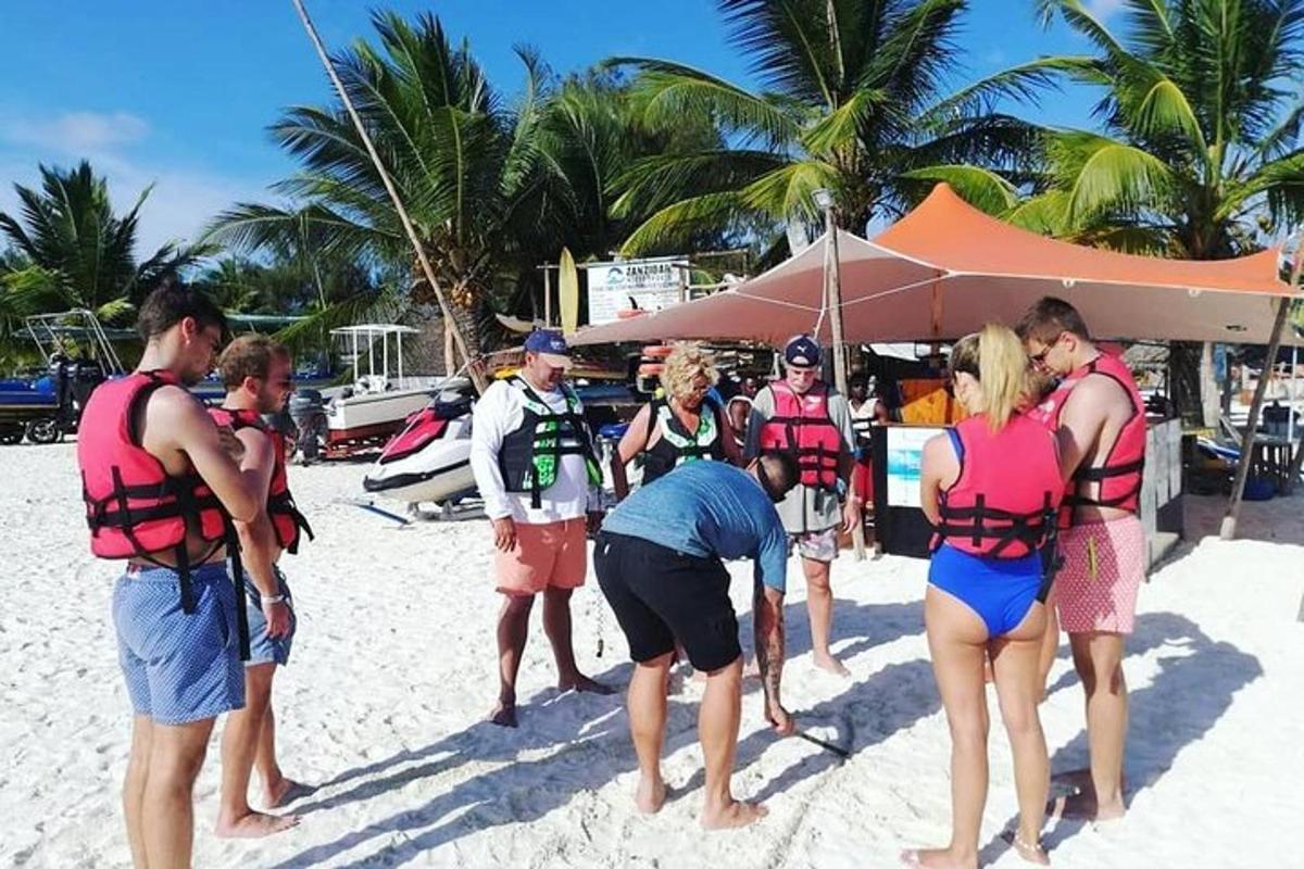 a group of people standing on the beach