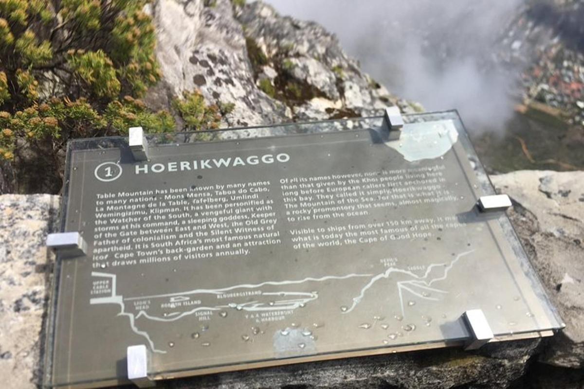 a sign on the side of a mountain