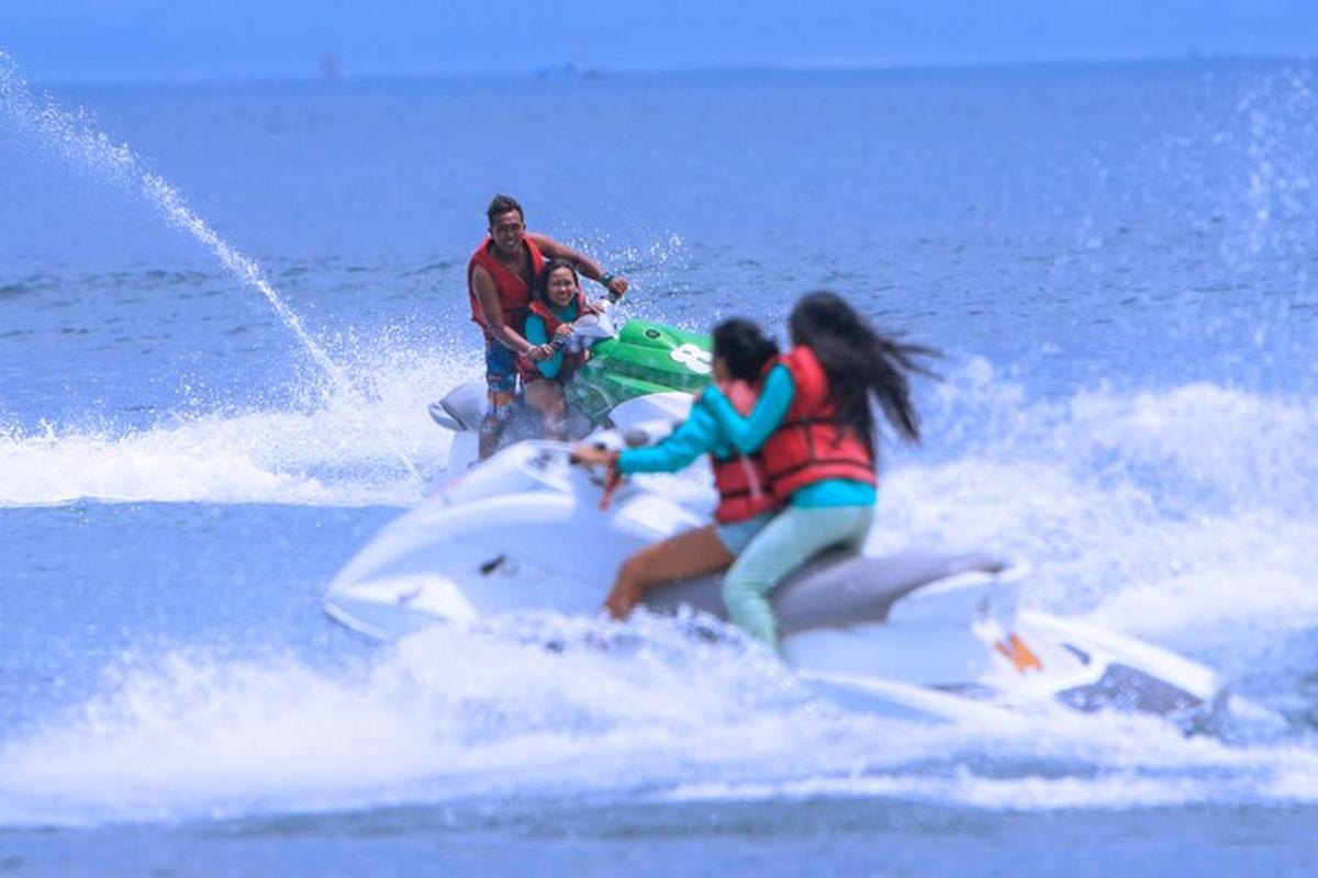 a group of people riding a jet ski in the water