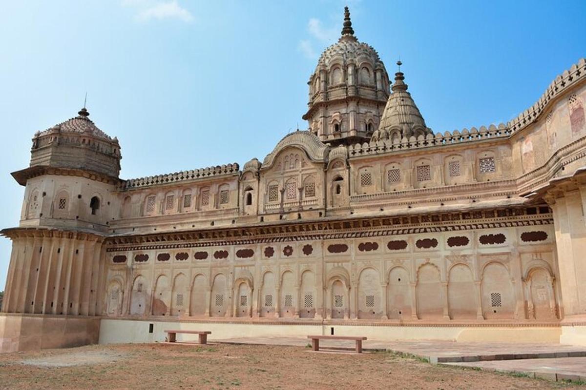 a large building with a bench in front of it