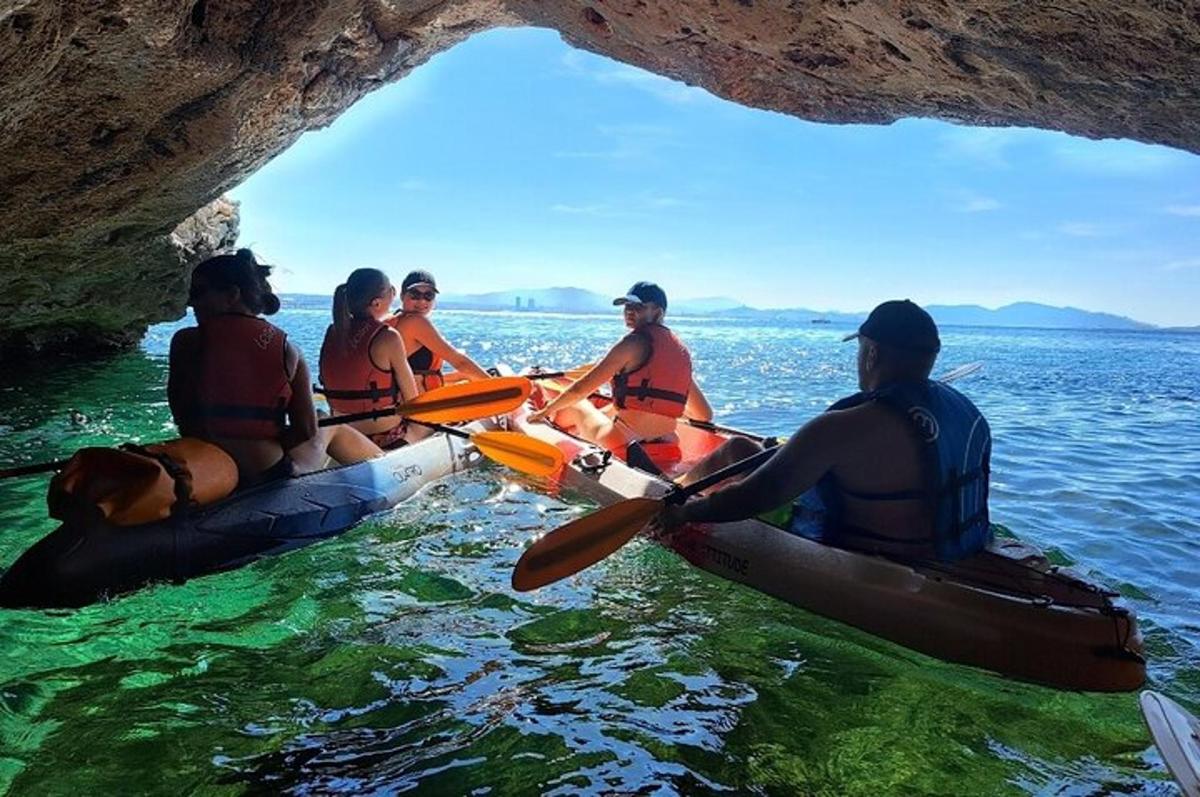 a group of people in kayaks in the water