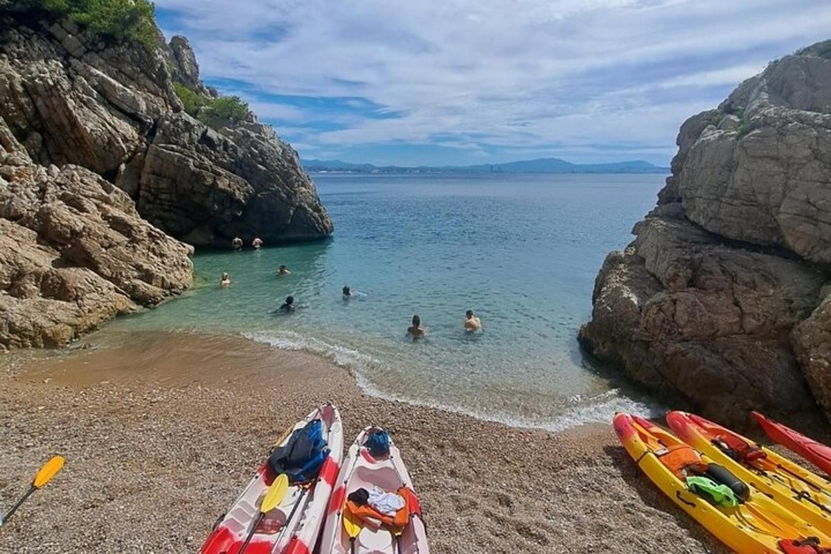 a group of people in the water at a beach