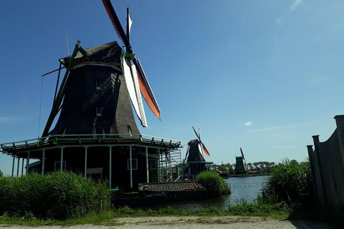 a couple of windmills sitting in the water