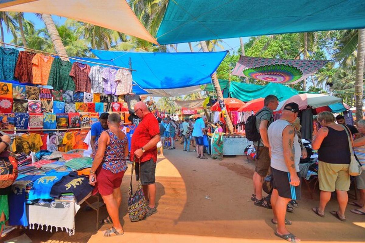 a group of people standing at an outdoor market