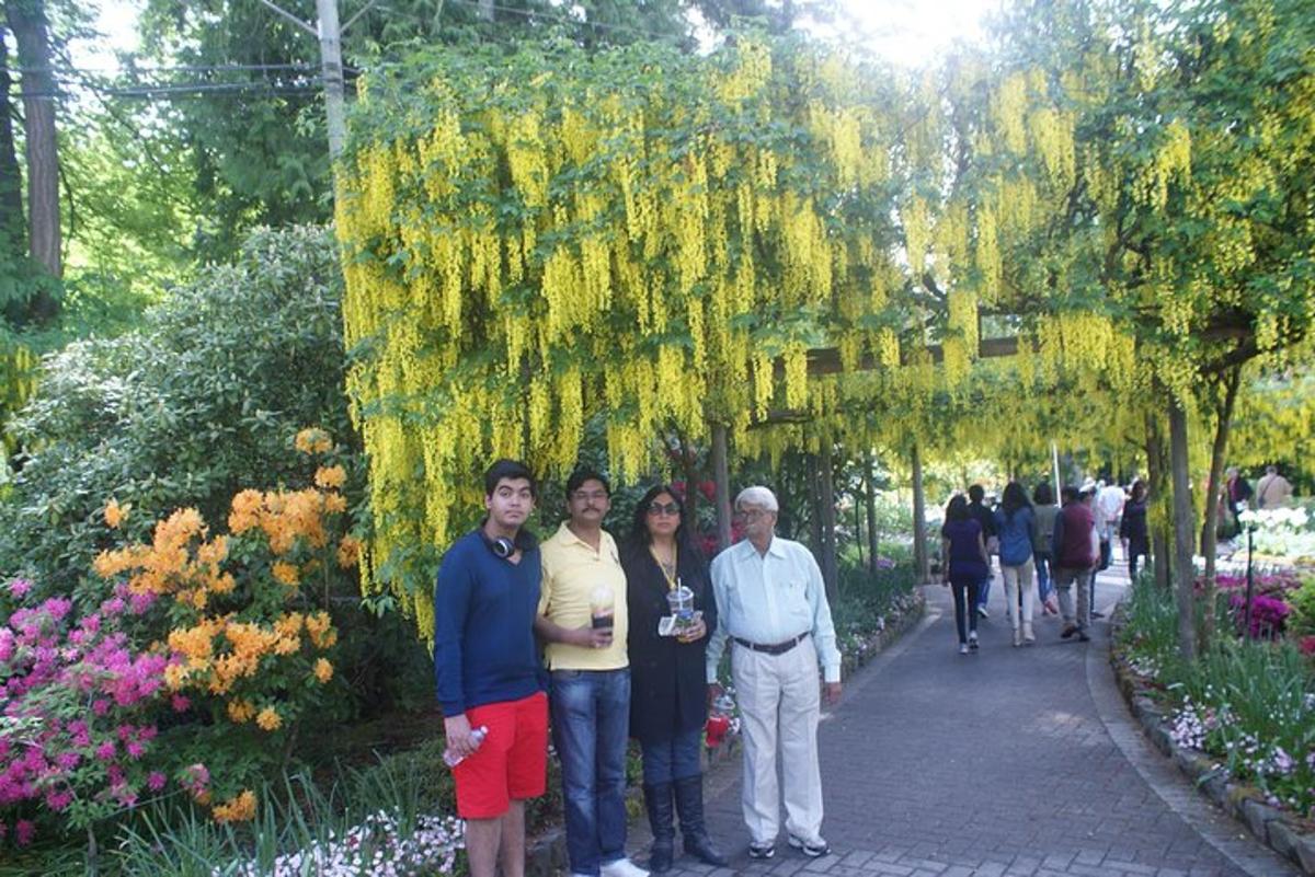 a group of people standing in a garden
