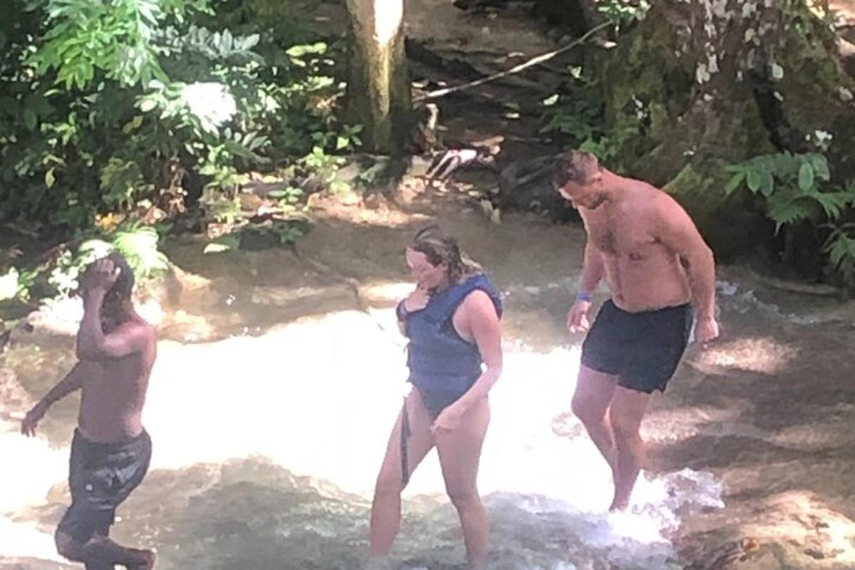a group of people standing in the water