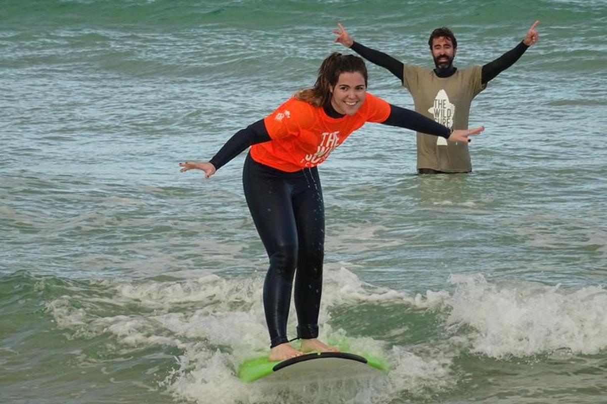 a woman riding a wave on a surfboard in the ocean