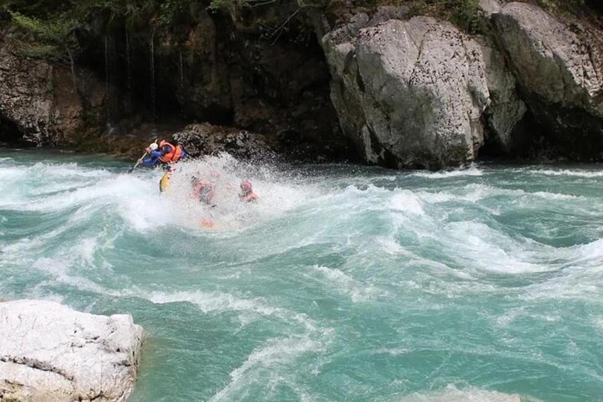 a man riding a raft in a river
