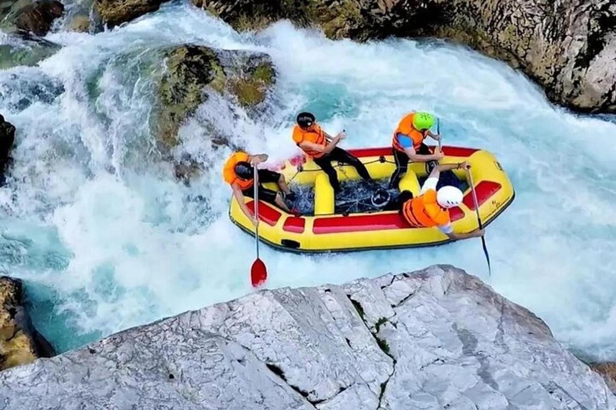 a group of people in a raft in a river