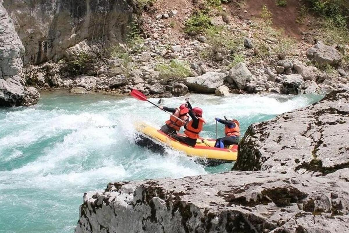 a group of people on a raft in a river