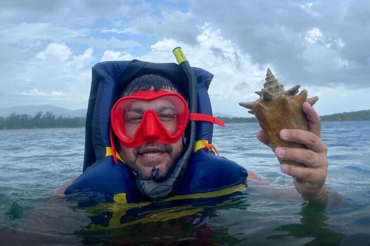 a man in the water with a mask and a star