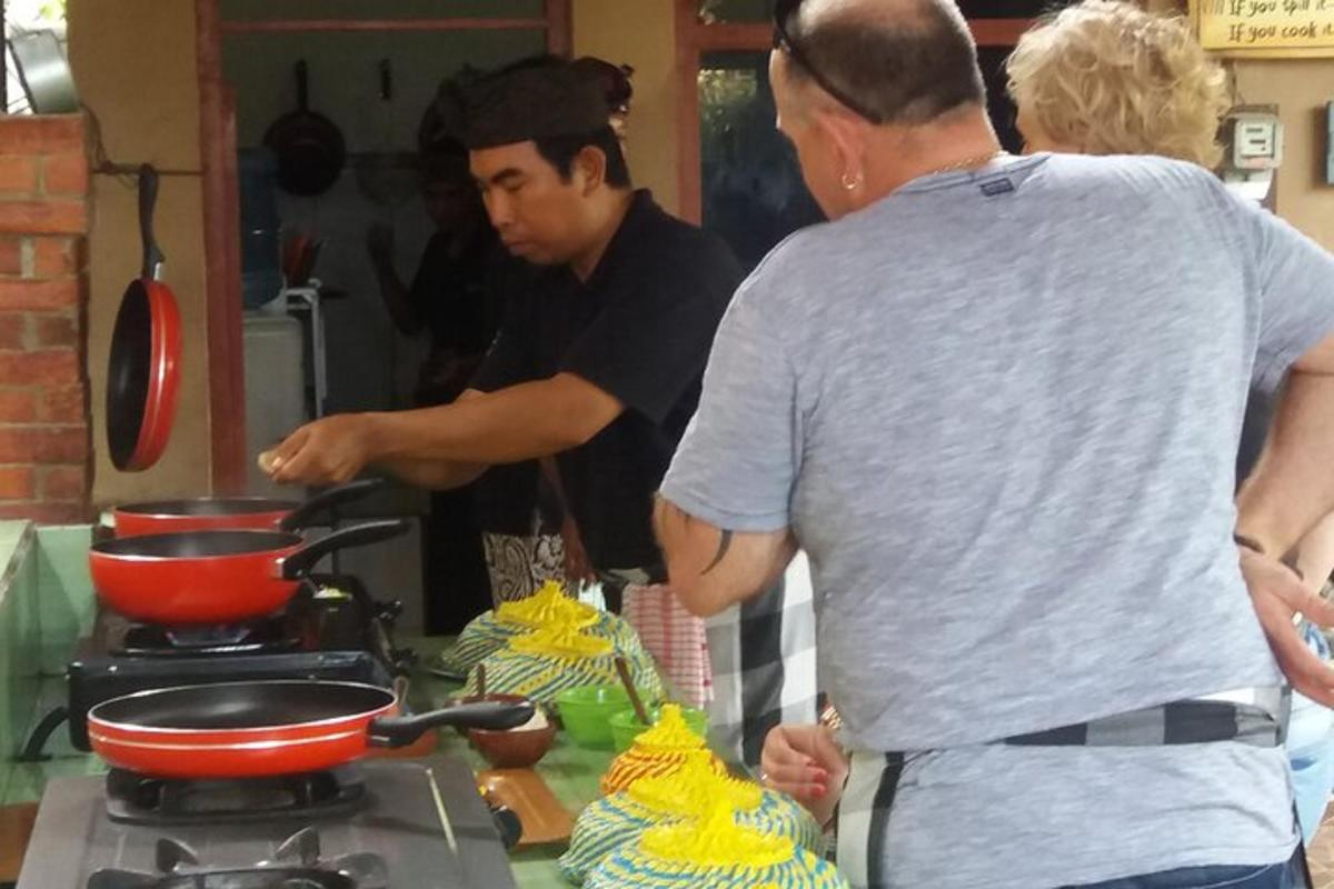 a group of people in a kitchen preparing food