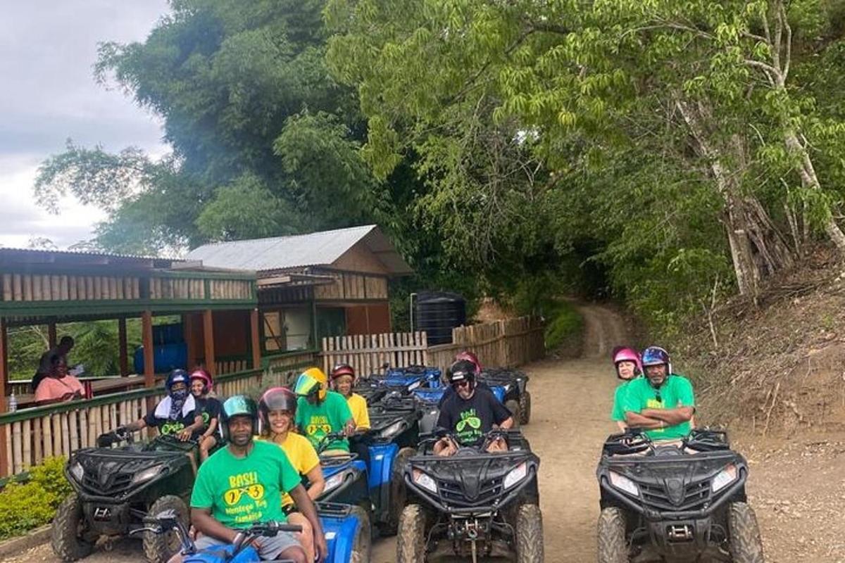 a group of people riding atvs on a dirt road