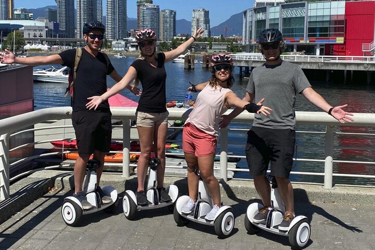 a group of four people riding on segways