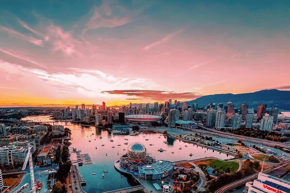 an aerial view of a city at sunset