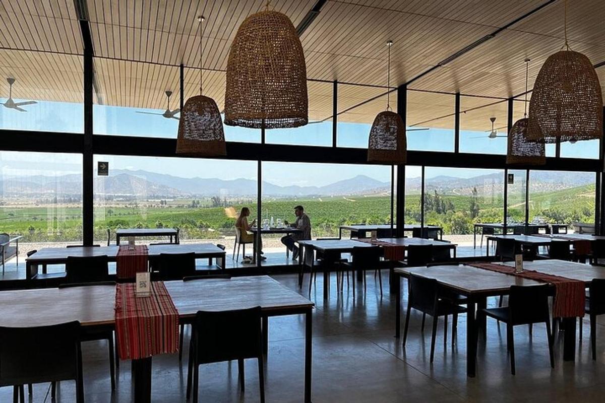 a restaurant with tables and chairs and a large window