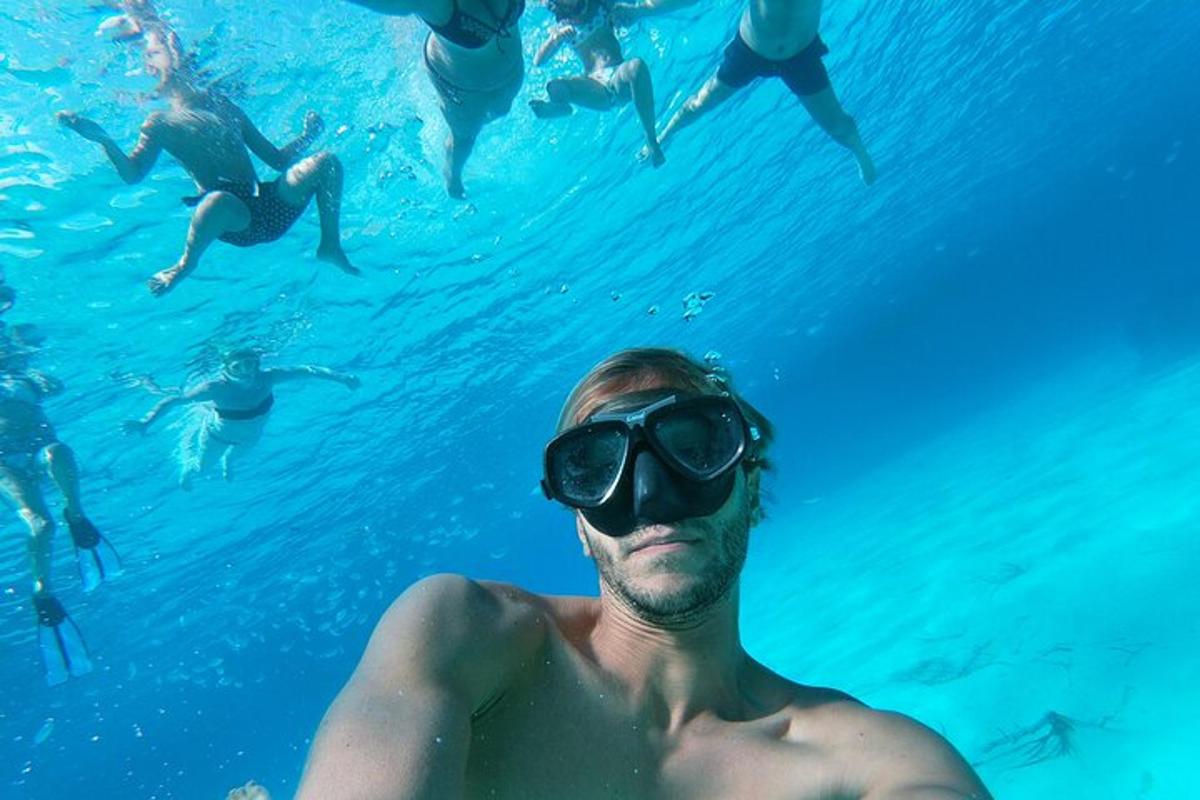 a group of people swimming in the water