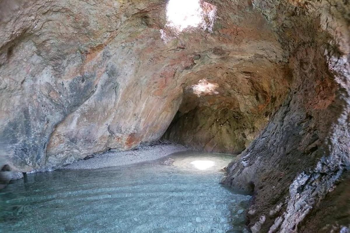 a cave with a pool of water in it