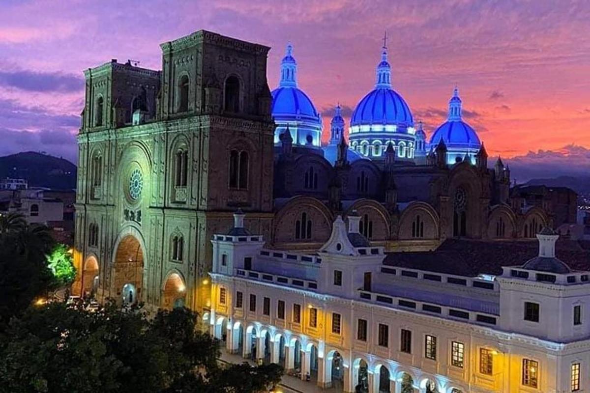 a large building with blue domes at night